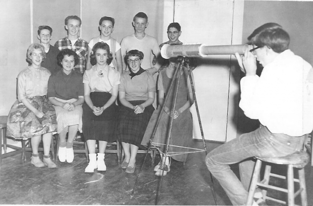 Me at the telescope with the cast of our freshman play, No Moon Tonight. The rest of the cast included (clockwise from upper left corner) Ray Wyatt, Dale Taylor, Joe Wingard, Dwight Spilseth, Fred Story, Neva Auseth (obscured), Linda Leman, Sherry Kent, G